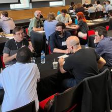 Faculty work in small groups during New Faculty Orientation training