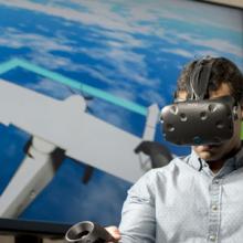 Student wears virtual reality goggles