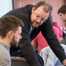 Professor works with a student
